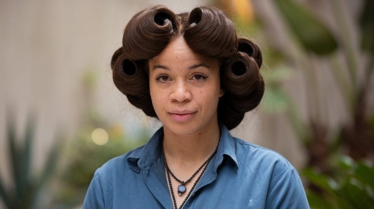 a photo of a black woman with a old silk press