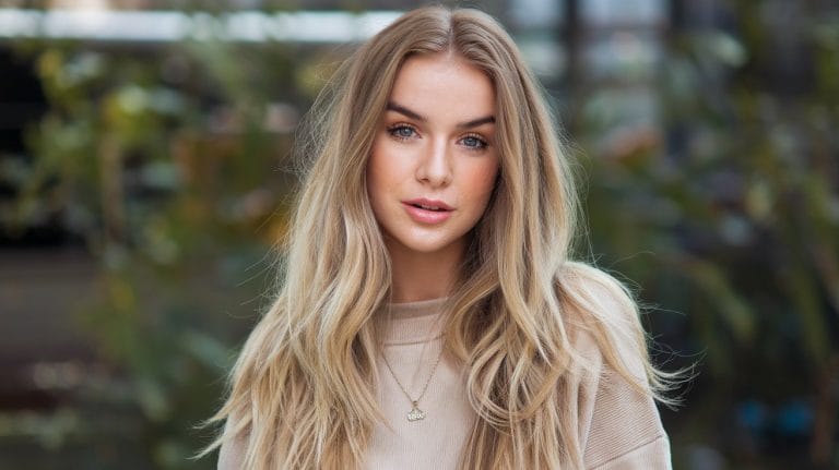 Woman with long blonde hair outdoors