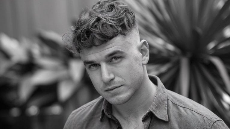 Man with short haircut in black and white photo