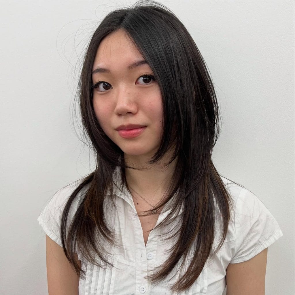 Person posing against a white background.