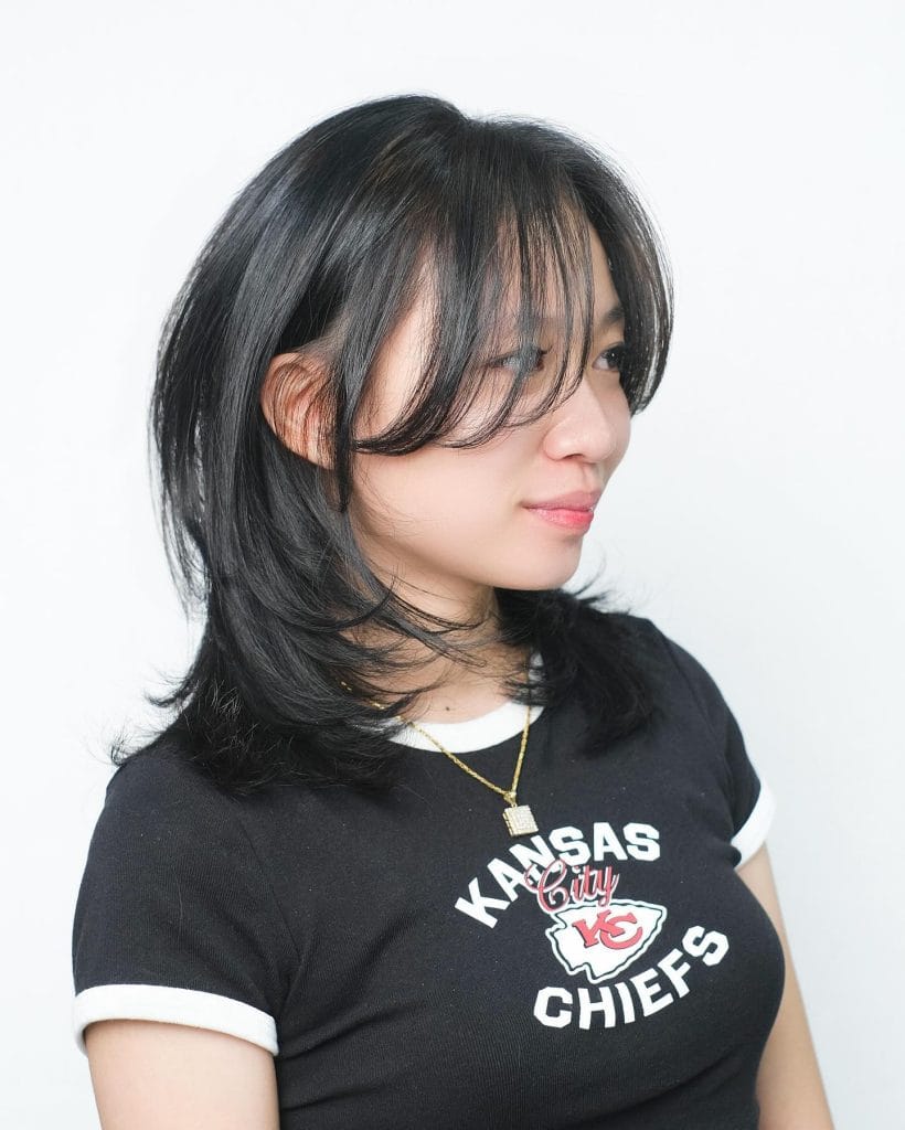 Person in Kansas City Chiefs shirt smiled.