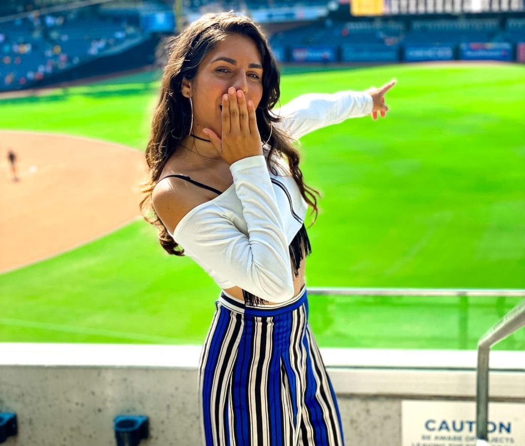 Surprised woman at a baseball stadium
